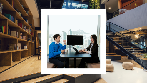 A photo of two professionals in a discussion, in an office with a mountain view, set against a modern staircase interior.